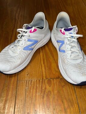 New Balance Women's White Running Shoes with purple and pink Accents